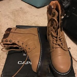 A pair of Ankle Boots. With zippers on side.